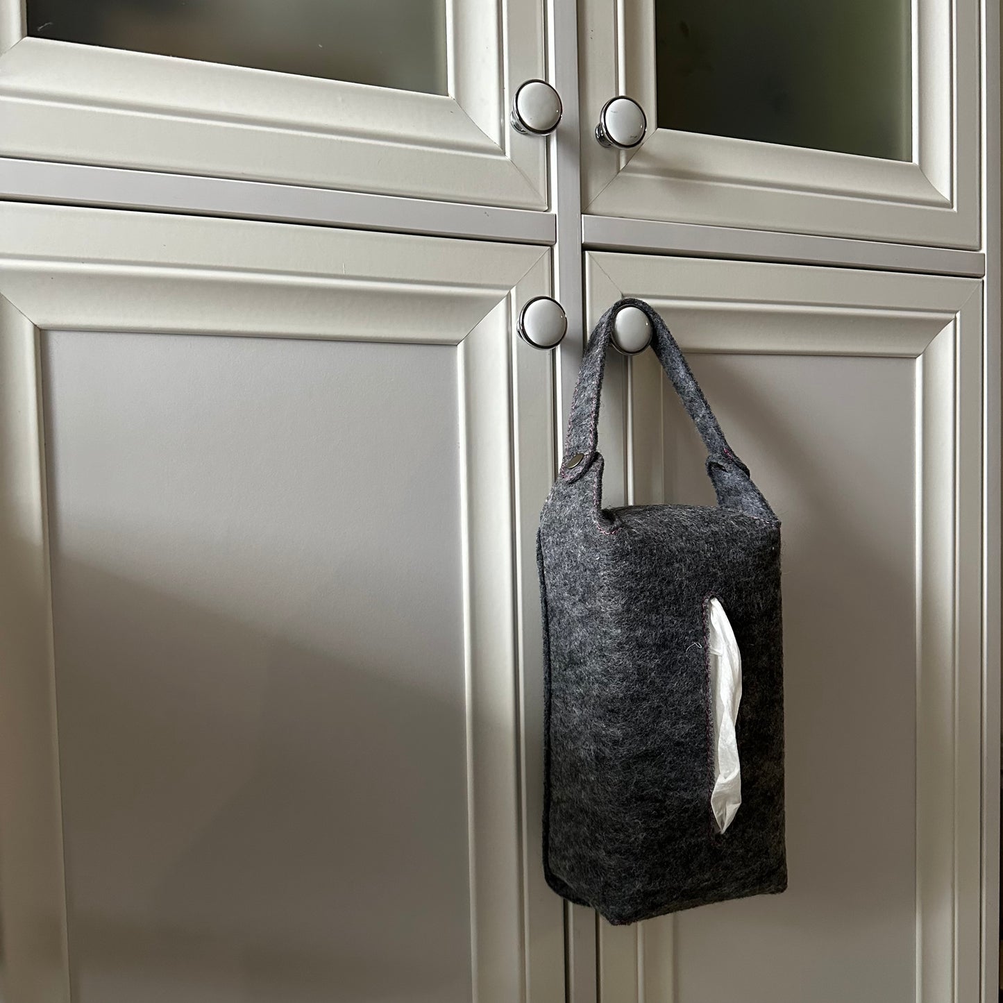 Gray felt tissue box cover with a white handle